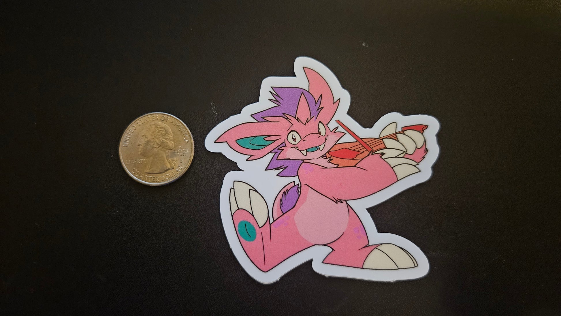 Sticker of Rhubarb's pink Nidorino fursona next to a coin on a black background