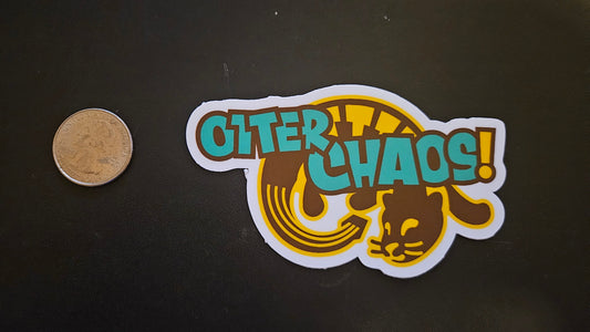 Otter Chaos! sticker next to a quarter to show it's size